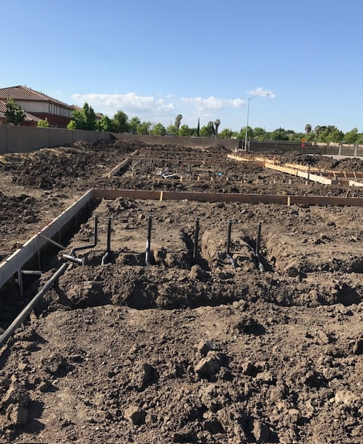 In-ground plumbing for subdivision