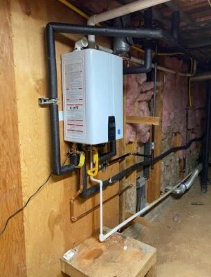 Tankless water heater on opposing wall of boilers